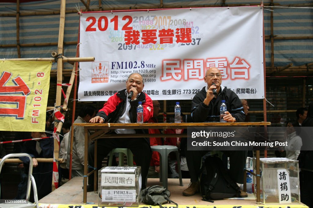 Kin Shing Tsang Kin-shing and Albert Chan Wai-yip of the Citizens' Radio raise ...