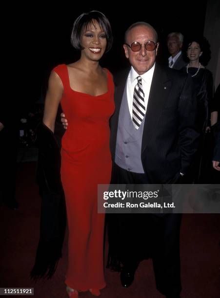 Singer Whitney Houston and Arista Records president Clive Davis attend the 41st Annual Grammy Awards Pre-Party Hosted by Clive Davis on February 23,...