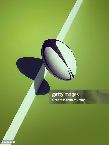 sports shadow - rugby ball stockfoto's en -beelden