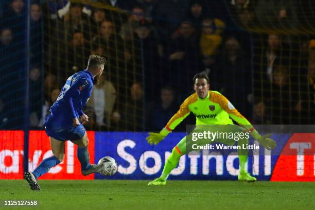 Scott Wagstaff of AFC Wimbledon scores his team's second goal during the FA Cup Fourth Round match between AFC Wimbledon and West Ham United at The...