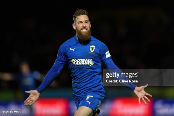 Scott Wagstaff of AFC Wimbledon celebrates after scoring his team's second goal during the FA Cup Fourth Round match between AFC Wimbledon and West...
