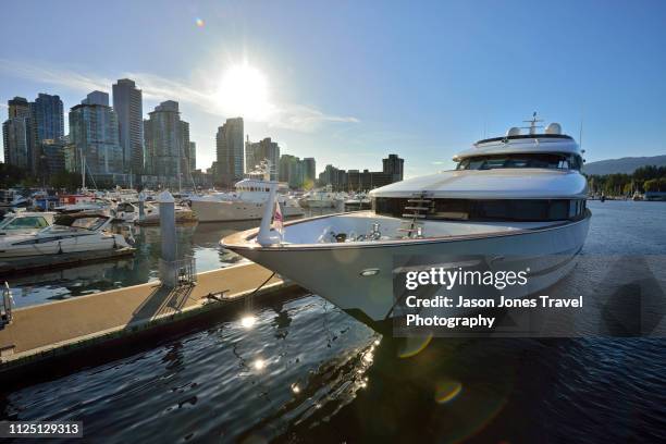 luxury yacht moored in vancouver harbour - boats moored stock pictures, royalty-free photos & images