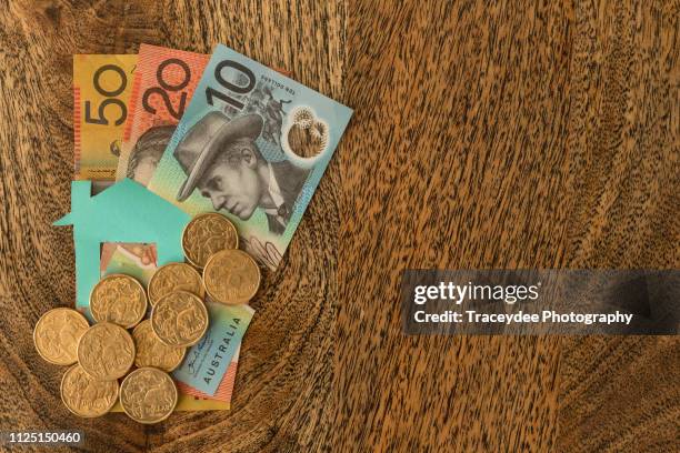 the great australian dream involves saving money for a family home. - australian coin stock pictures, royalty-free photos & images