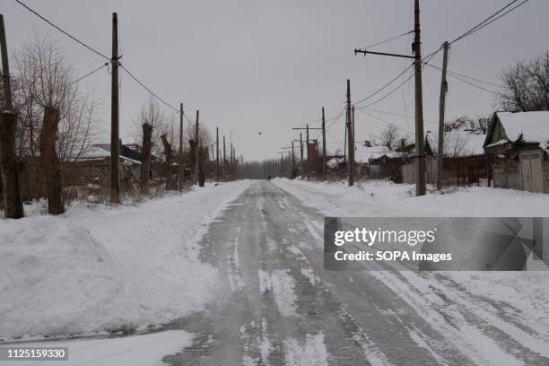 An abandoned road by most families since the shelling is so frequent it's close to the front-line. The war between the Ukrainian army and the...