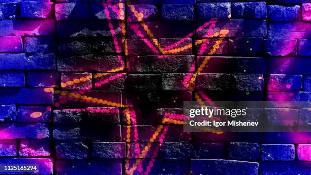 Star shapes on a bright background. Virtual graffiti. Abstract image, drawn on a photo of a brick wall.