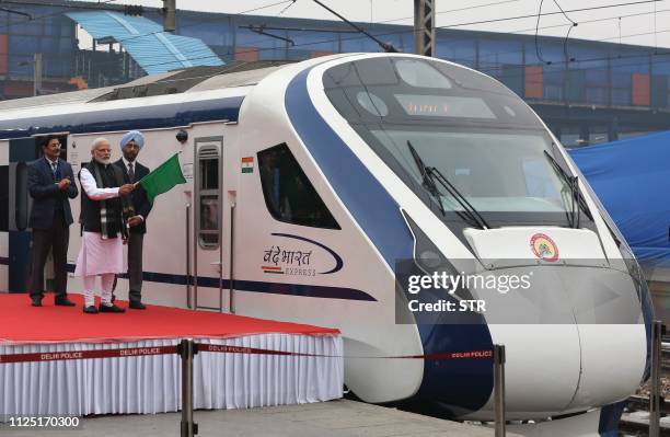 In this photo taken on February 15 Indian Prime Minister Narendra Modi flags off India's first semi-high speed express train Vande Bharat Express at...