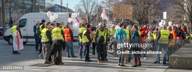 February 2019, Saxony, Dresden: Demonstrators of the collection movement "Aufstehen - Die Sammlungsbewegung" stand at one of the nationwide rallies...