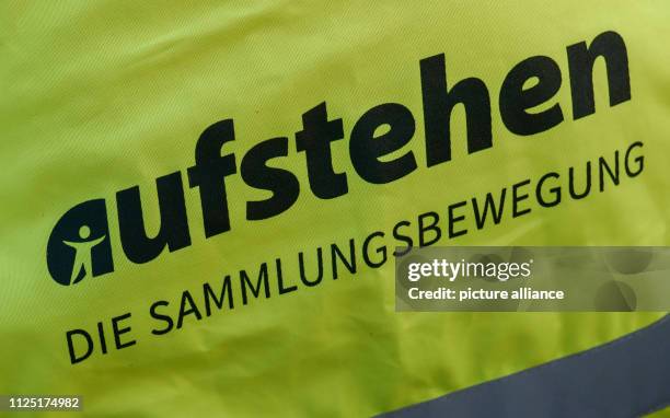 February 2019, Saxony, Dresden: A warning vest with the inscription of the collection movement of the same name "Aufstehen - Die Sammlungsbewegung"...