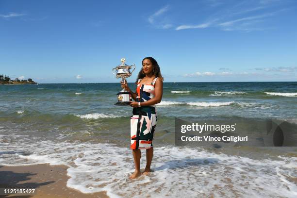 Naomi Osaka of Japan poses with the Daphne Akhurst Memorial Cup during the Women's Australian Open media opportunity at Brighton Beach on January 27,...