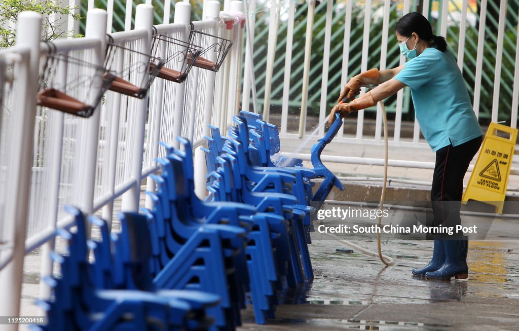 Cleaner cleaning chairs at Salvation Army Tin Ka Ping Kindergarten after outbreaks of scarlet fever . A child died of this month after catching the disease. 22JUN11