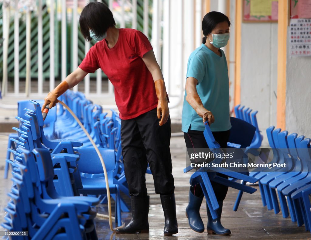 Cleaners cleaning chairs at Salvation Army Tin Ka Ping Kindergarten after outbreaks of scarlet fever . A child died of this month after catching the disease. 22JUN11