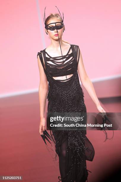 Model displays collection by Hong Kong designer Himma Wong in "Into The Light-Hong Kong New Design Force" during Hong Kong Fashion Week for...