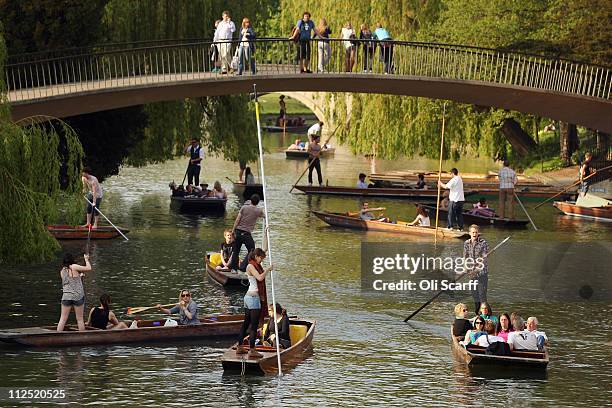 Members of the public punt along the river Cam in front of the colleges of Cambridge University on April 19, 2011 in Cambridge, England. The UK is...