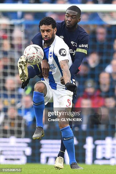 Derby County's English defender Fikayo Tomori vies with Brighton's Dutch striker Jurgen Locadia during the English FA Cup fifth round football match...