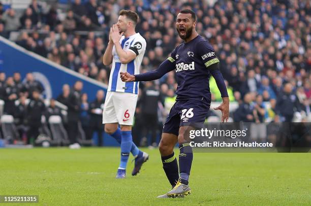 Ashley Cole of Derby County celebrates after scoring his team's first goal as Dale Stephens of Brighton and Hove Albion reacts during the FA Cup...