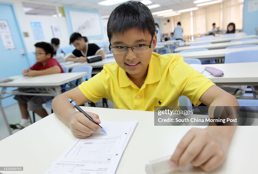 Klement Choi Man-ian pose pictures in tutorial class at Kumon in Causeway Bay. 30AUG11