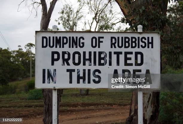 'dumping of rubbish prohibited in this area' sign in canberra nature reserve, campbell, australian capital territory, australia - unloading stock pictures, royalty-free photos & images