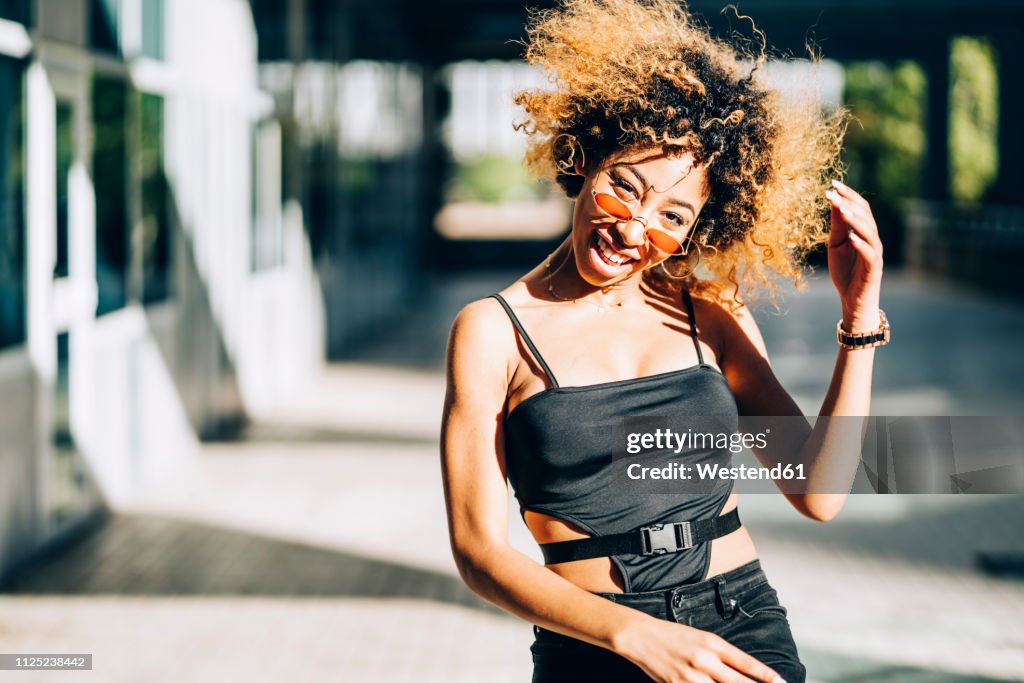 Portrait of young woman dancing outdoors
