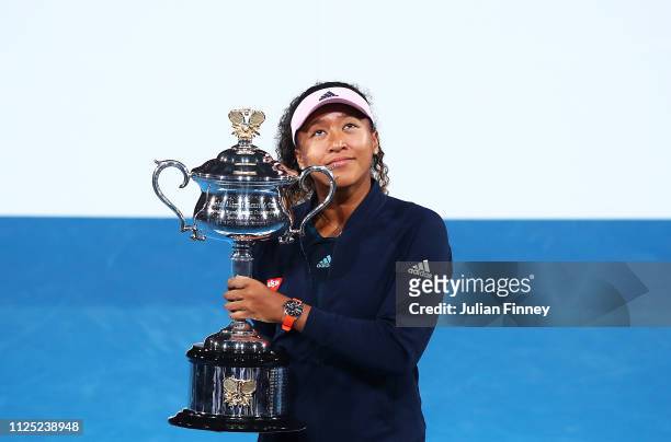 Naomi Osaka of Japan with the Daphne Akhurst Memorial Cup following victory in her Women's Singles Final match against Petra Kvitova of the Czech...