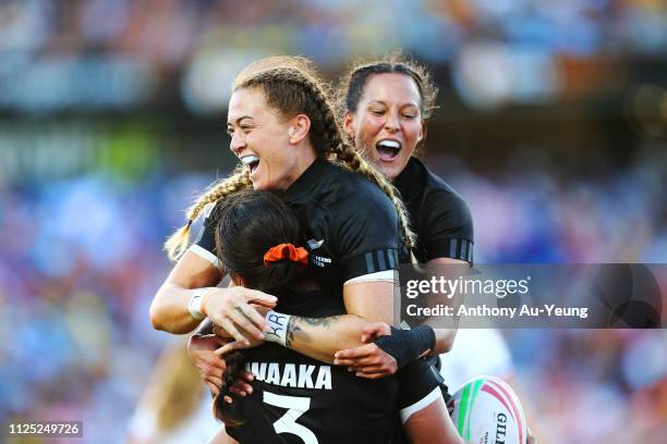 Niall Williams, Tyla Nathan-Wong and Stacey Waaka of the Black Ferns Sevens celebrate after winning against France during day two of the 2019...