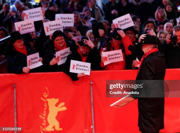 Festival director Dieter Kosslick greets his fans as he arrives for the award ceremony of the 69th Berlinale International Film Festival Berlin in...