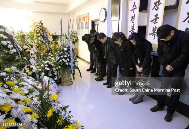 People mourn Kim Jong-il in the Dandong Office of North Korea Shenyan Consulate in Dandong, Liaoning province, the border city between China and...