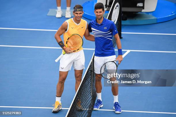 Rafael Nadal of Spain Standing along side Novak Djokovic of Serbia before playing during day 14 of the 2019 Australian Open at Melbourne Park on...