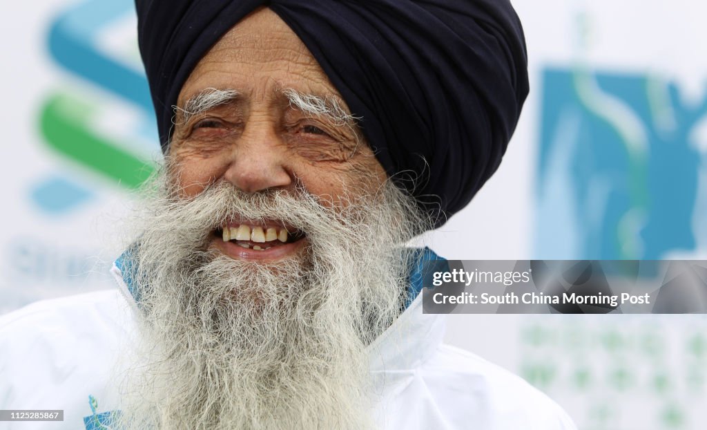 Fauja Singh, who is 100 years old, poses for a photo in Causeway Bay. He will take part in the Standard Chartered Hong Kong Marathon 2012. 02FEB12