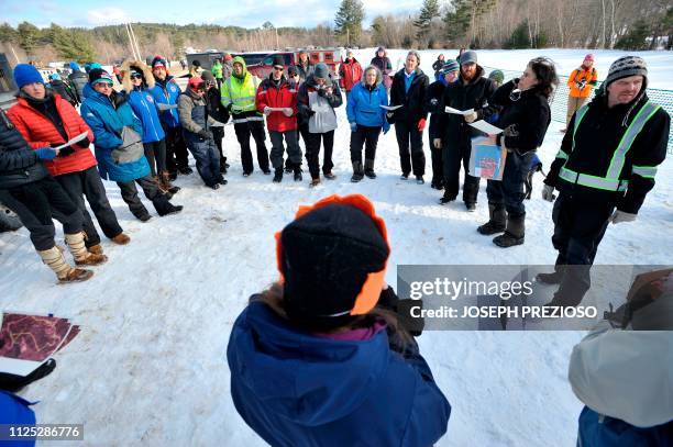 Race organizer Elizabeth Strobridge holds a meeting with the mushers prior to the race start during the second annual Blue Mountain Sled Dog and...