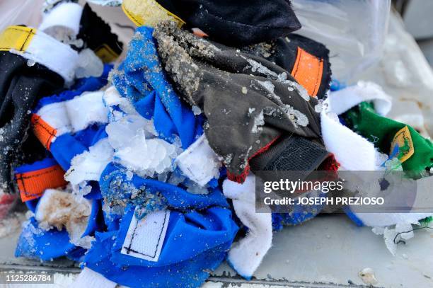 Pile of frozen dog boots sits on a truck shelf after the race during the second annual Blue Mountain Sled Dog and North Country Musher's mid distance...