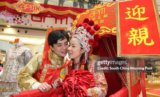 Couple from Mainland Tang Zibin and his wife Tang Kityu dress antique Chinese style dresses in a wedding memorabilia exhibition by APM in Kwun Tong....