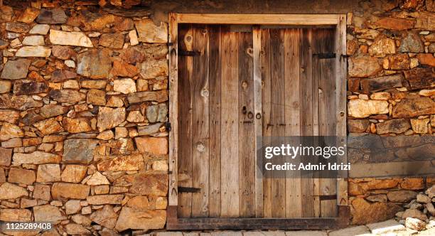 an old wooden door - barn stock pictures, royalty-free photos & images