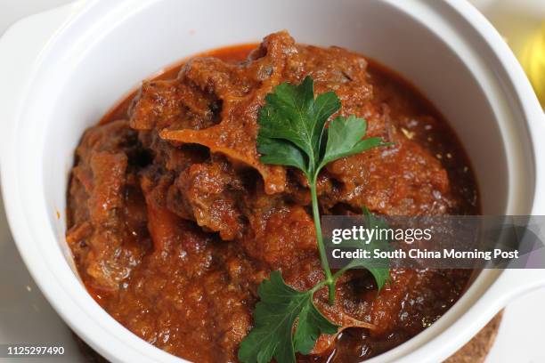 Food shot of "Slow Cooked Ox Tail Stew" at Nino's Cozinha, QRE Plaza in Wan Chai. 29FEB12