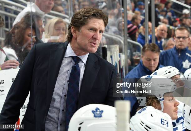 Head coach Mike Babcock of the Toronto Maple Leafs watches from the bench during first period action against the Arizona Coyotes at Gila River Arena...