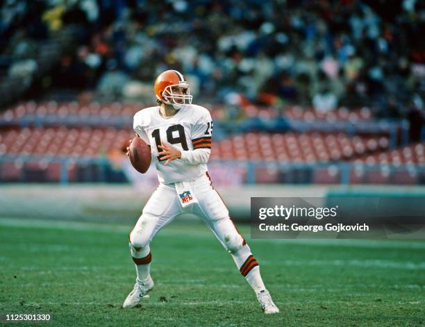 Quarterback Bernie Kosar of the Cleveland Browns looks to pass during a National Football League game at Cleveland Municipal Stadium in 1986 in...