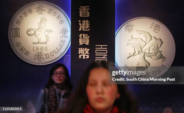 People are seen at the venue of "Hong Kong Currency" exhibition. The exhibition will be open to the public from March 14 until June 4, 2012 in Hong...