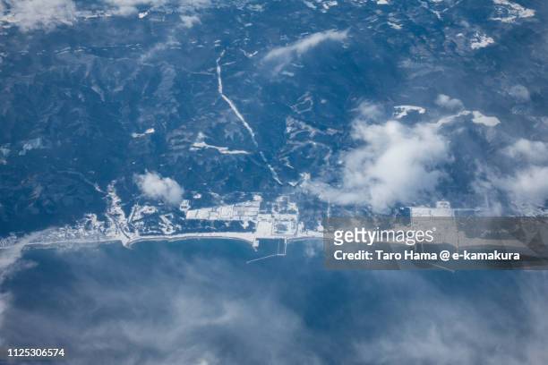 nuclear power station in higashidori village in aomori prefecture in japan daytime aerial view from airplane - higashidori nuclear power plant stock pictures, royalty-free photos & images