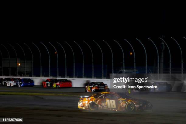 Kyle Busch, driver of the Joe Gibbs Racing M&M's Chocolate Bar Toyota Camry, spins during the Gander RV Duel on February 14, 2019 at Daytona...