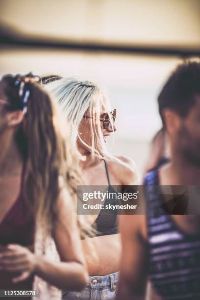 beautiful woman having fun on a party in summer day. - beach music festival stock pictures, royalty-free photos & images