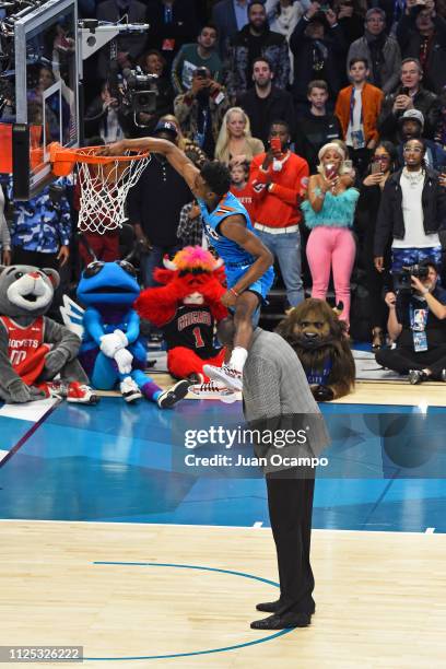 Hamidou Diallo of the Oklahoma City Thunder dunks the ball over Shaquille O'Neal during the 2019 AT&T Slam Dunk Conest on February 16, 2019 at the...