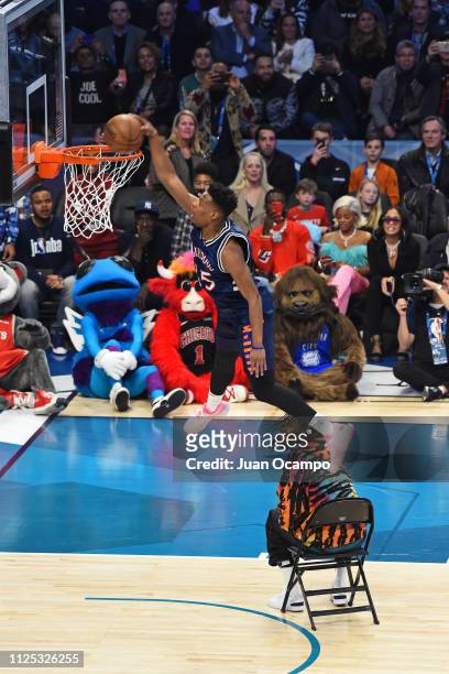 Dennis Smith Jr. #5 of the New York Knicks dunks the ball over Rapper, J Cole during the 2019 AT&T Slam Dunk Conest on February 16, 2019 at the...