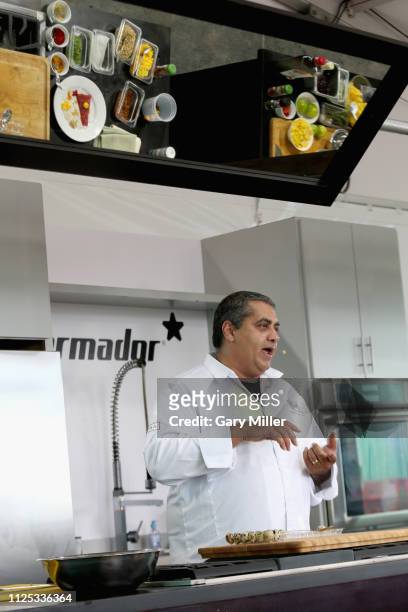 Chef Michael Mina gives a cooking demonstration during the sold out inaugural KAABOO Cayman Festival at Seven Mile Beach on February 15, 2019 in...