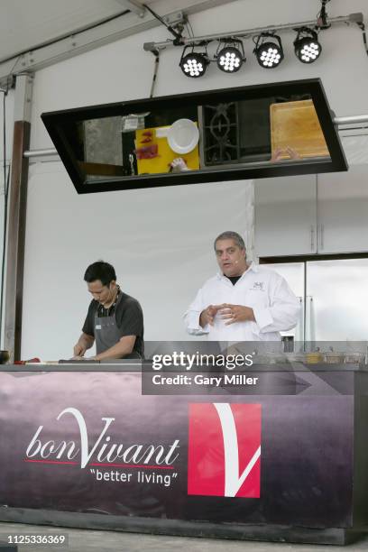 Chef Michael Mina gives a cooking demonstration during the sold out inaugural KAABOO Cayman Festival at Seven Mile Beach on February 15, 2019 in...