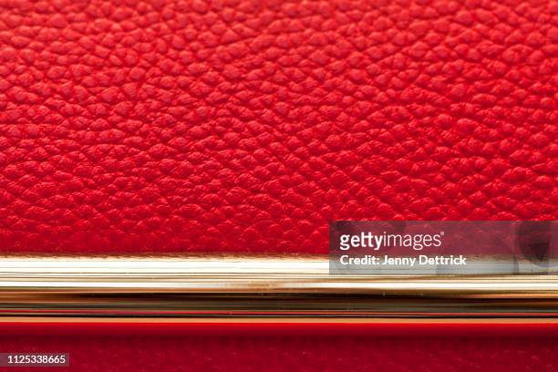 close-up of red leather handbag with gold - red leather purse stockfoto's en -beelden