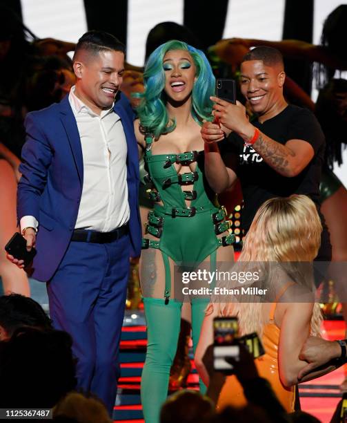 Rapper Cardi B invites attendees onstage as she performs during the 2019 Adult Video News Awards at The Joint inside the Hard Rock Hotel & Casino on...