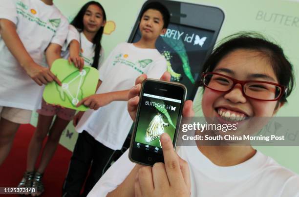 Holly Wong Hoi-ling, Gigi Wong Hoi-ching, Tom Tse Chun-hong and Winnie Chan Wing-yan show a iPhone app "BUTTERFLY id" which can identify the...