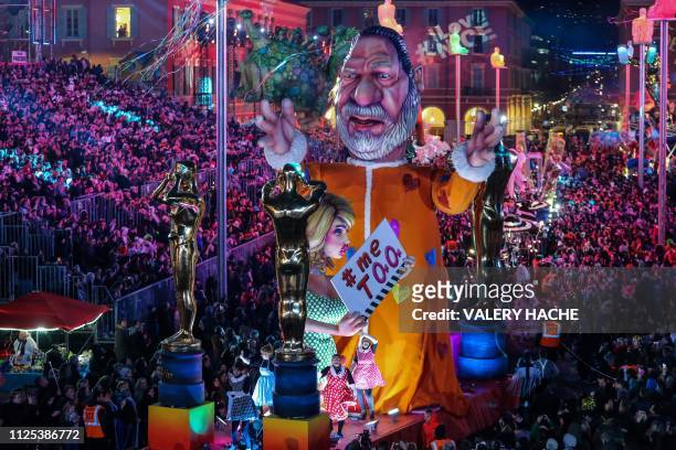Float with a statue depicting US producer Harvey Weinstein parades on the first day of the 135th Nice Carnival which runs until March 2 with the...