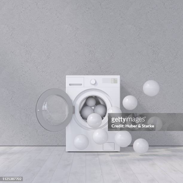 washing machine against concrete wall - washing machine with bubbles stock pictures, royalty-free photos & images