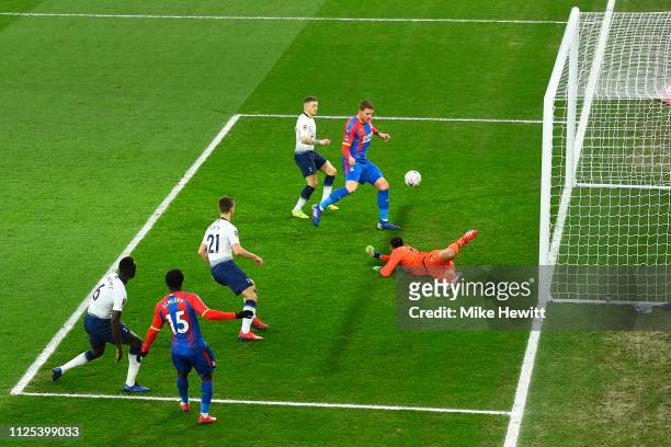 Goalkeeper Paulo Gazzaniga of Tottenham Hotspur knocks the ball into the path of Connor Wickham of Crystal Palace who scores the opening goal during...
