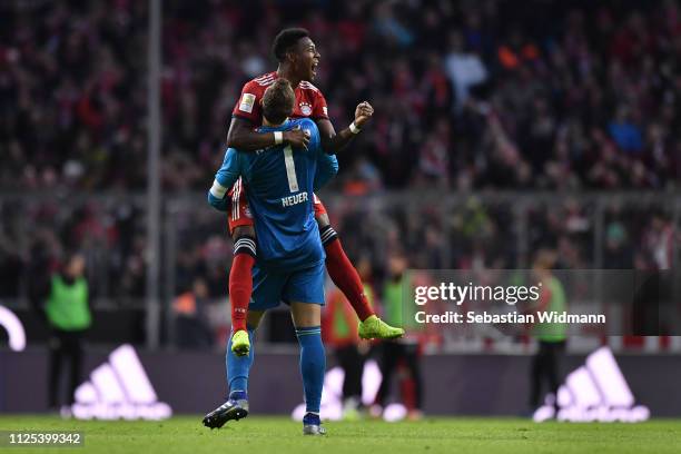 Manuel Neuer and David Alaba of Bayern Munich celebrate their team's third goal during the Bundesliga match between FC Bayern Muenchen and VfB...